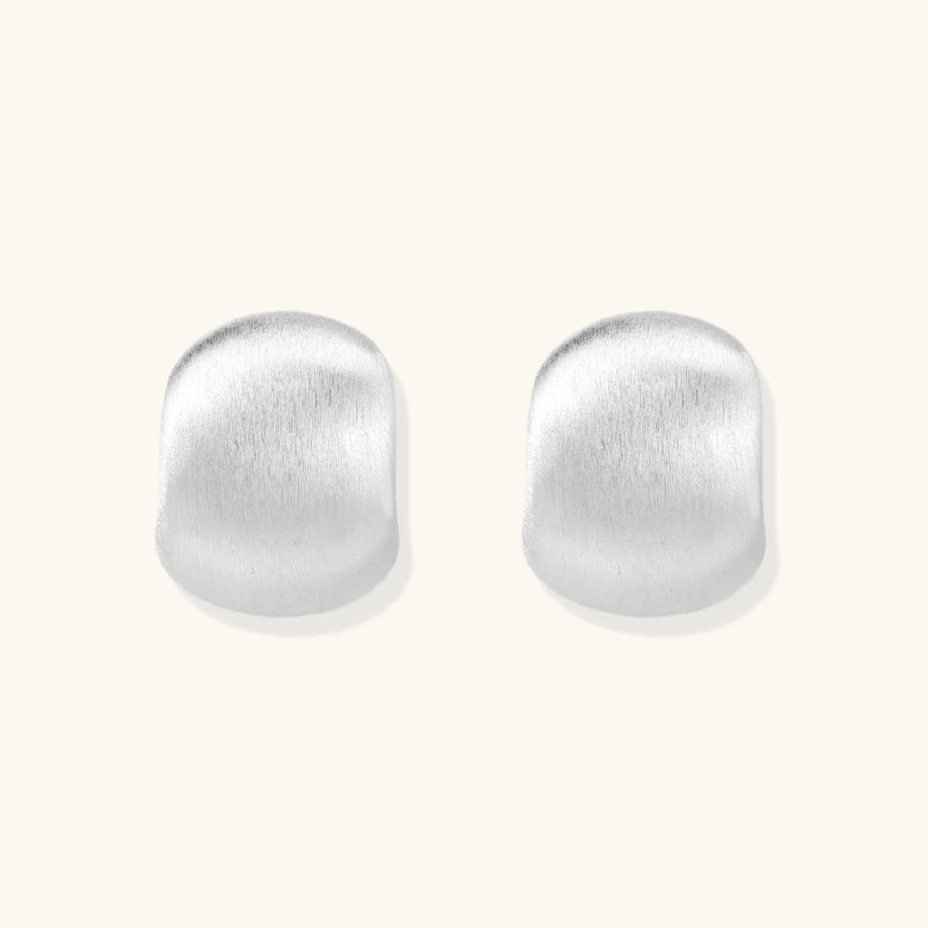 Brushed sterling silver cushion-shaped stud earrings with matte finish on white background