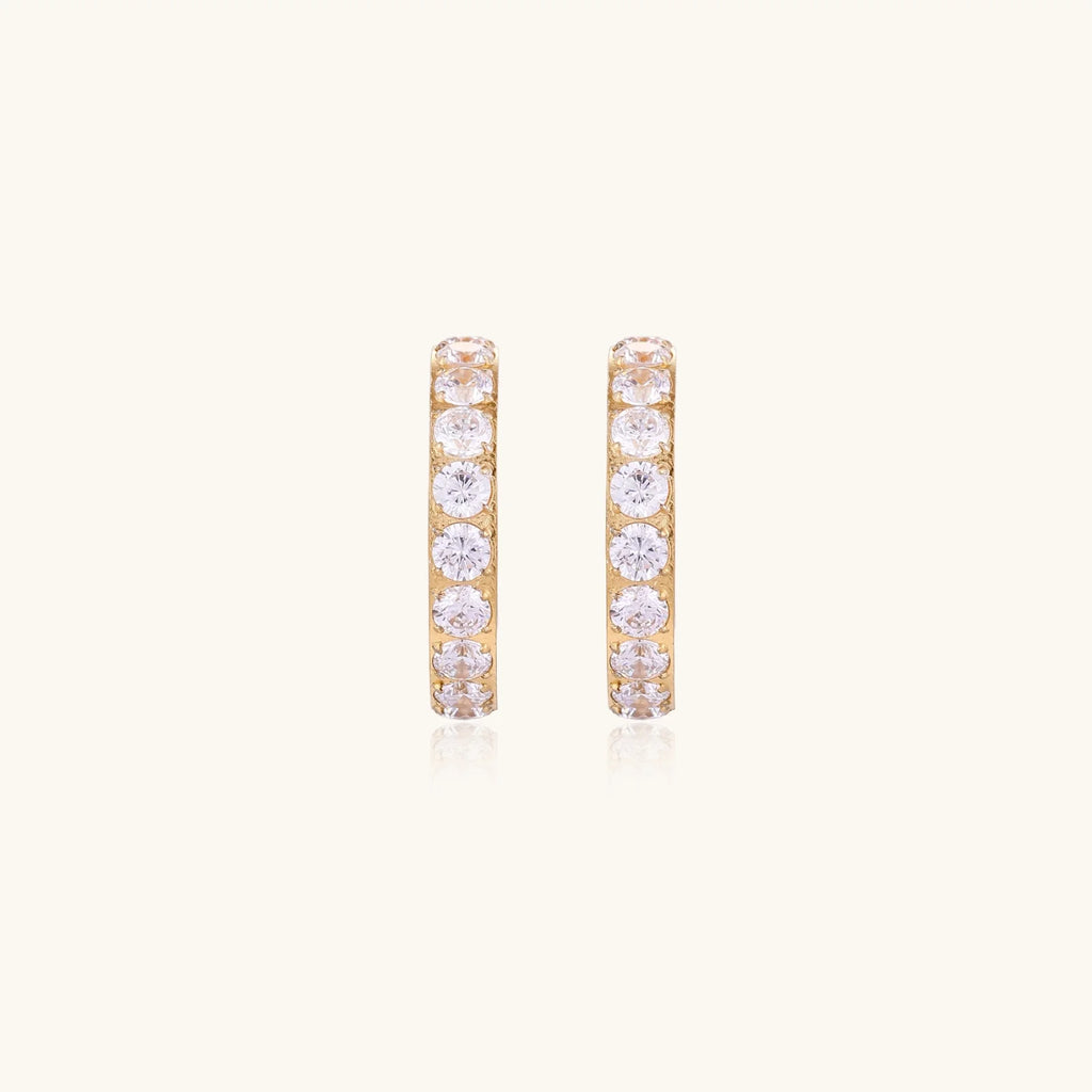 Gold pavé hoop earrings with two freshwater pearls nestled inside the curved design, featuring crystal-studded outer edge.