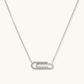 White gold plated necklace with dual-frame geometric pendant featuring crystal pavé border on pale background.